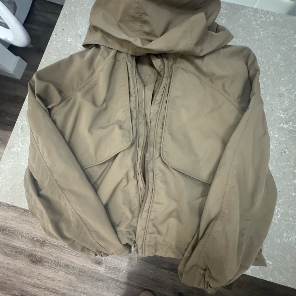 Lululemon Athletica tan hooded rain jacket